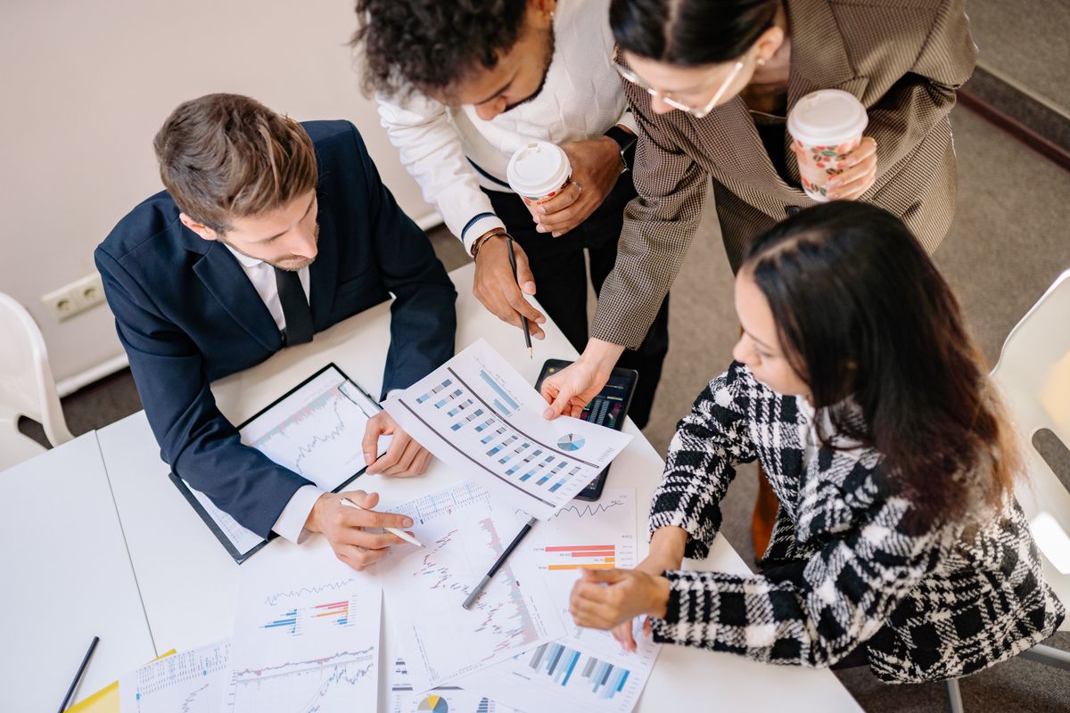 Business team reviewing investment planning charts