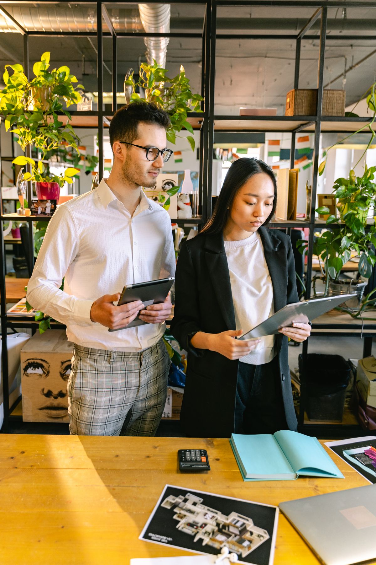 Colleagues reviewing work during workplace training